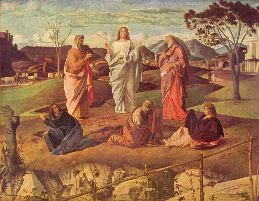 Christ stands transfigured between Moses and Elijah on a low green hill, the three apostles fallen at his feet.